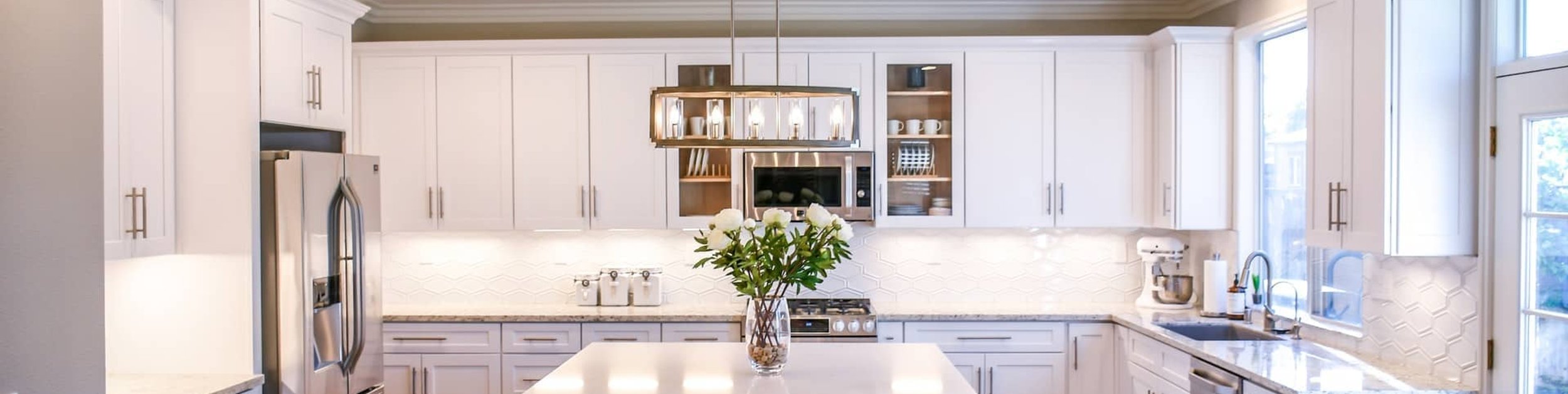 modern kitchen with white custom cabinetry