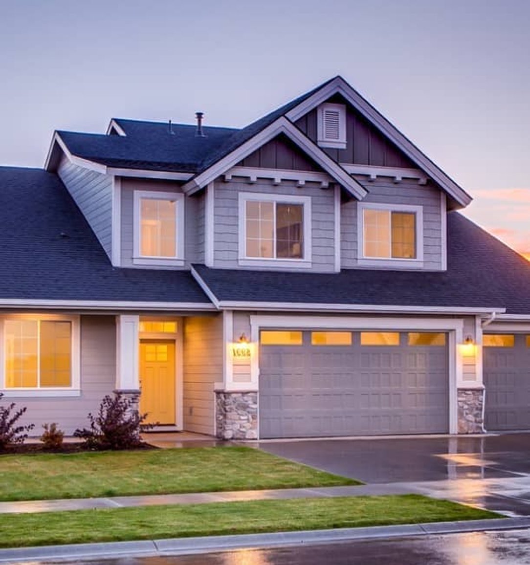 two-story suburban home exterior at dusk