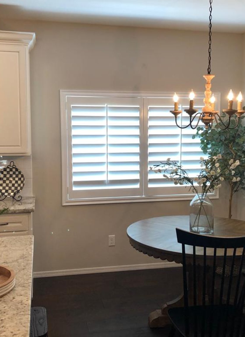 white plantation shutters in a kitchen breakfast nook